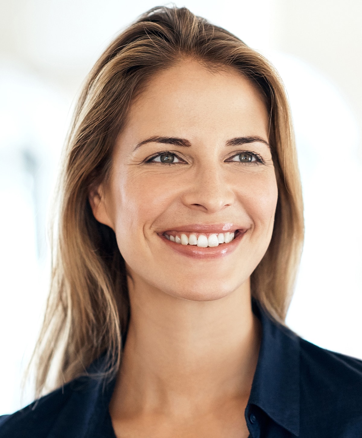 Smiling woman with long hair and natural beauty.