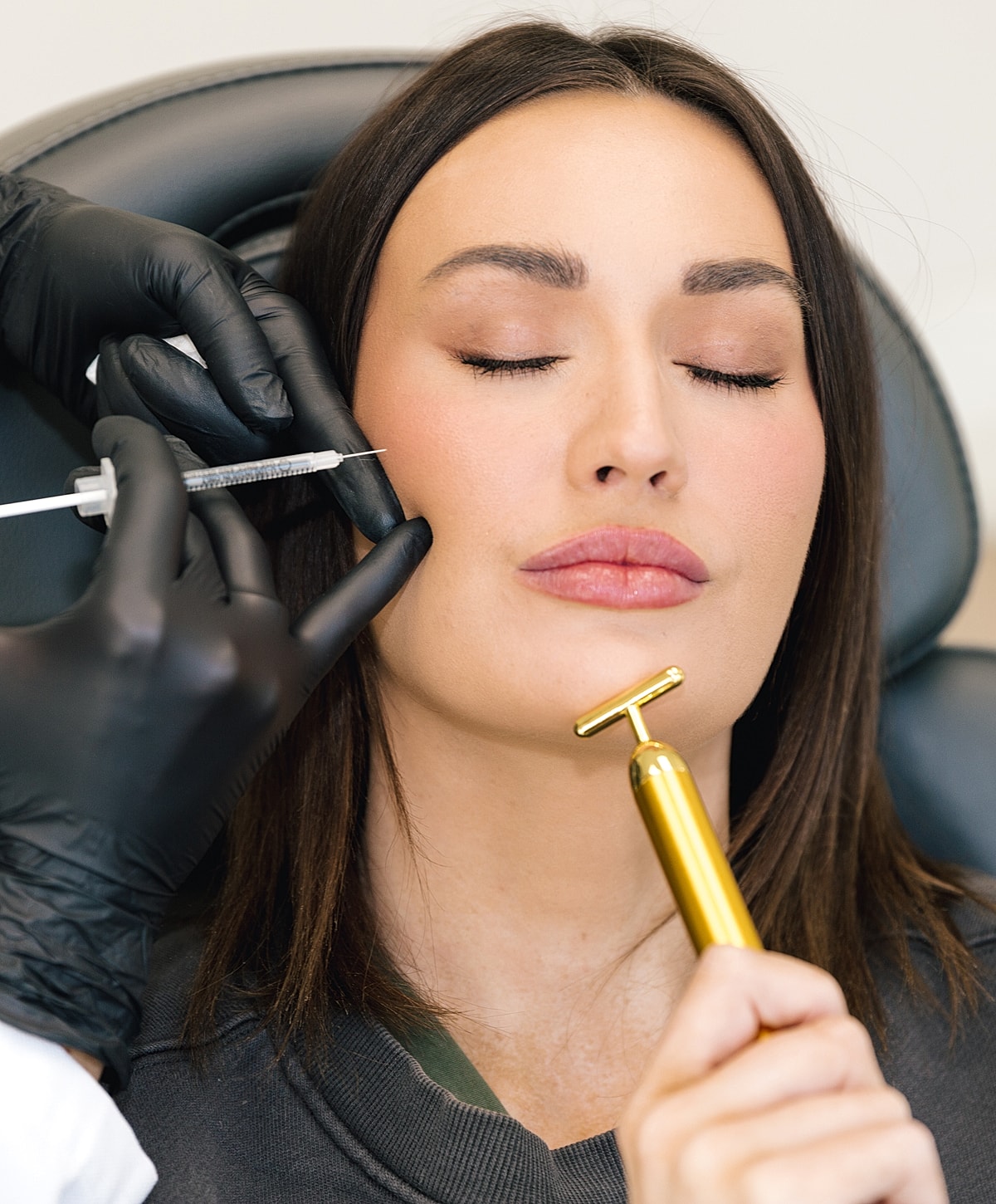 Injecting cosmetic treatment on a Salt Lake City dermal fillers model's face.