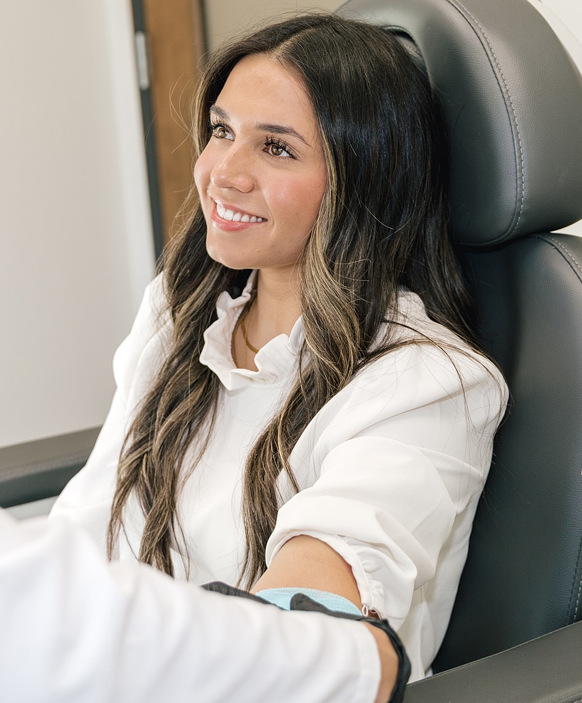 Patient smiling during a medical procedure.