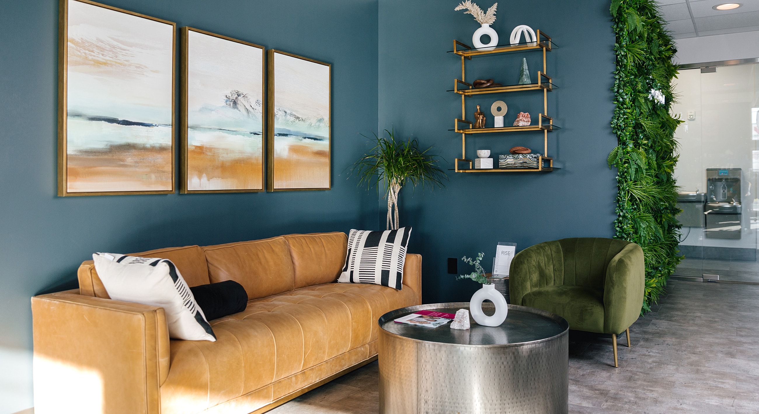 Modern living room with art and greenery.