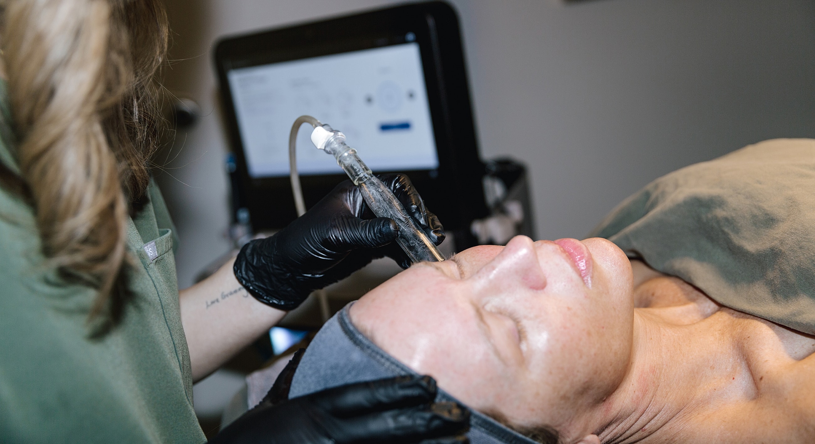 Facial treatment session with a skincare professional.