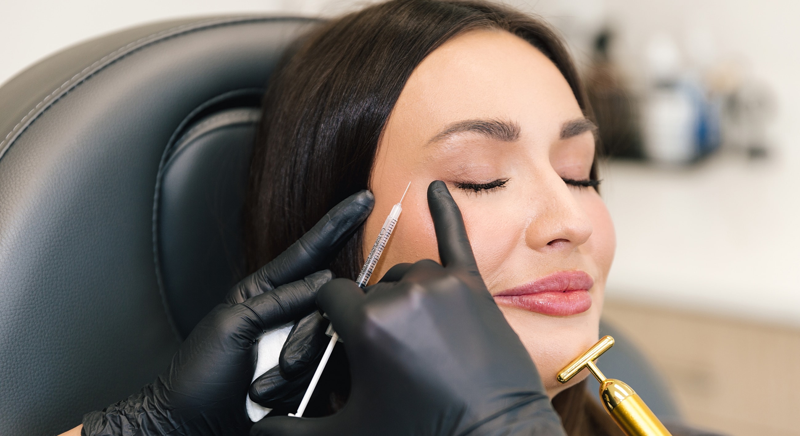 Salt Lake City dermal fillers model procedure in progress with patient relaxing.