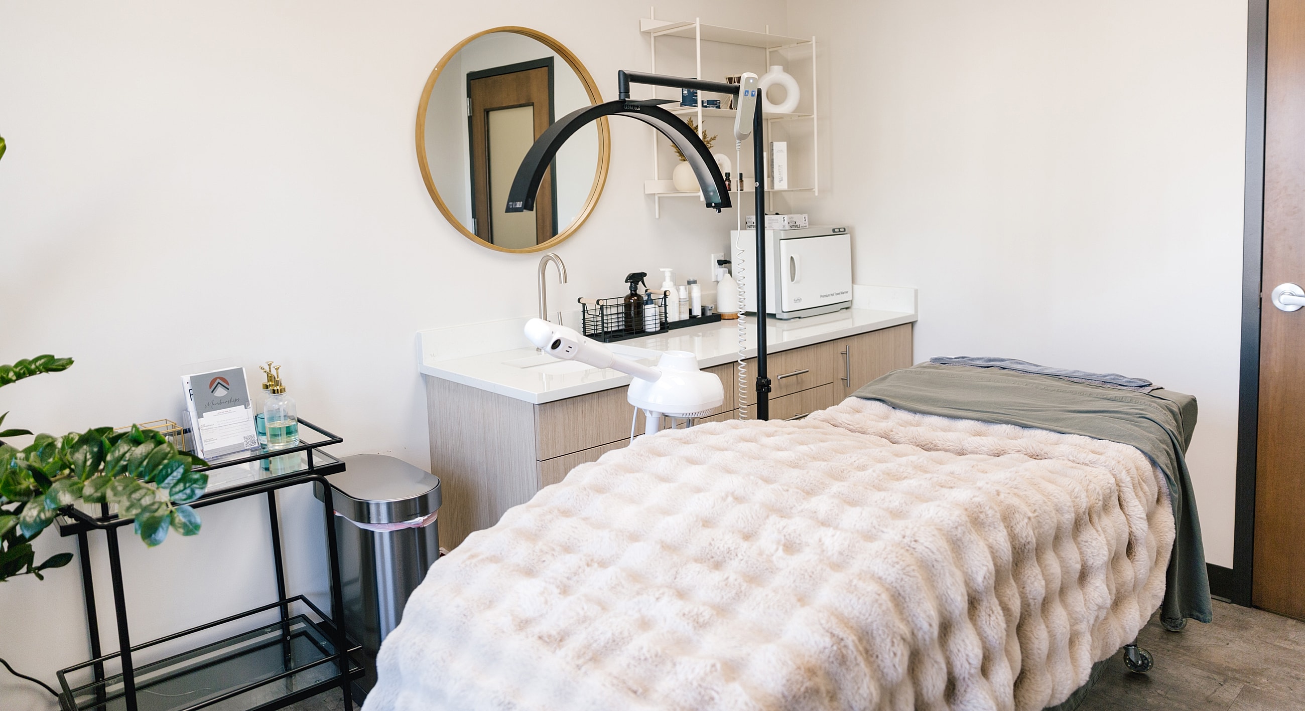 Well-equipped Salt Lake City laser treatment room with cozy ambiance.