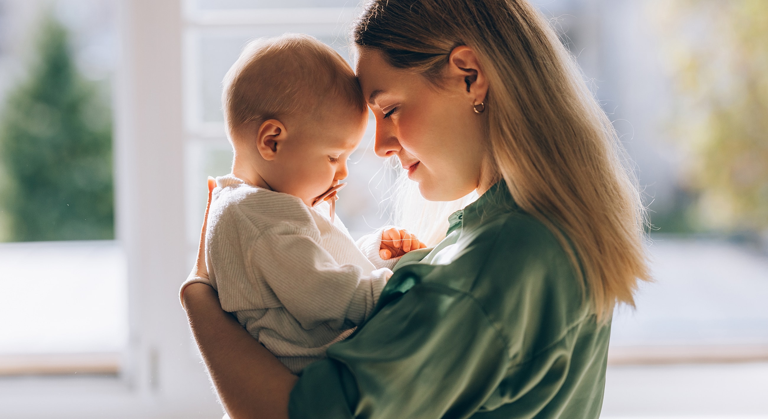 Mother and baby sharing a tender moment.