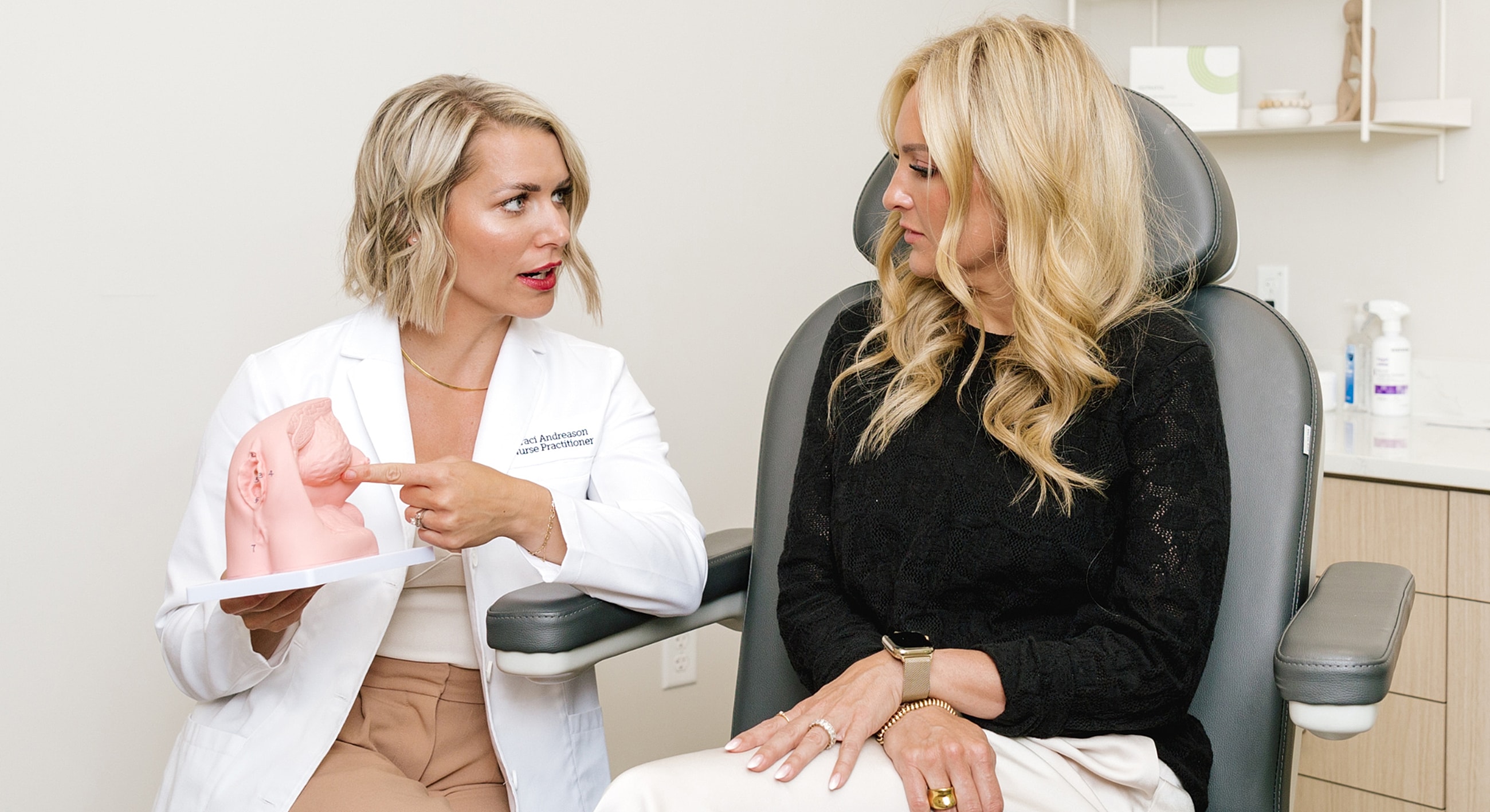 Nurse practitioner discussing procedure with patient.